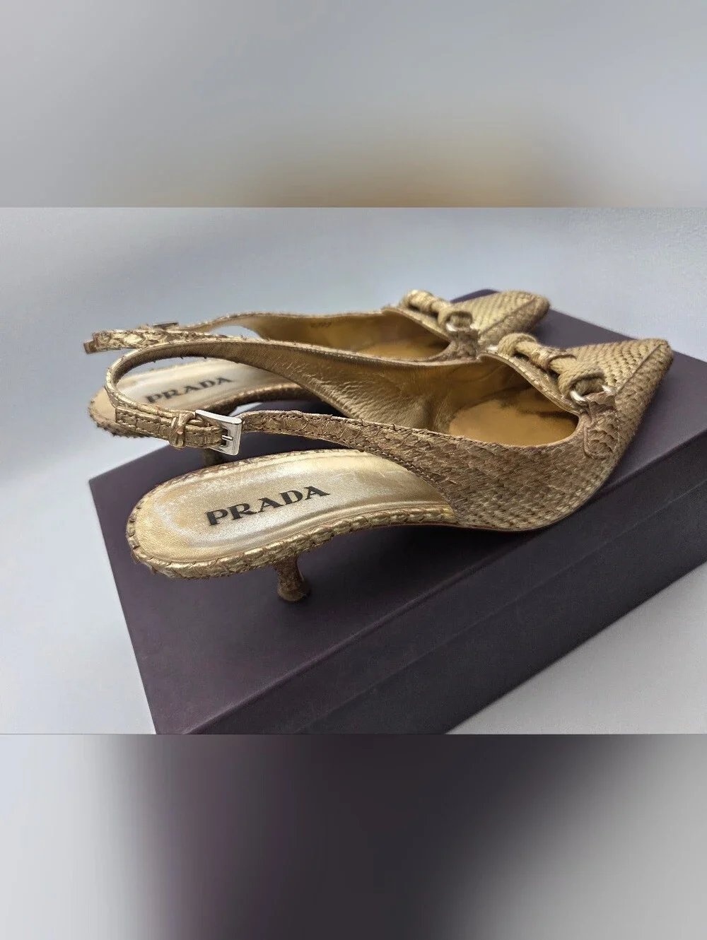 Pre- owned Prada snakeskin braided accents slingback pumps in a metallic gold